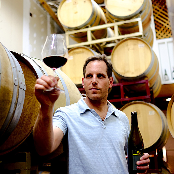 benjamin silver inspecting a glass of wine
